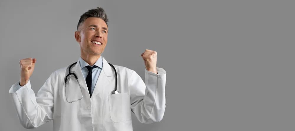 Doctor smiling confidently, representing improved experience and professional confidence