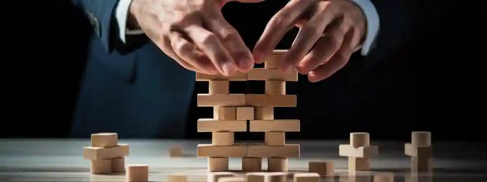 Manager arranging dominoes to represent planned marketing execution Manager arranging dominoes to represent planned marketing execution